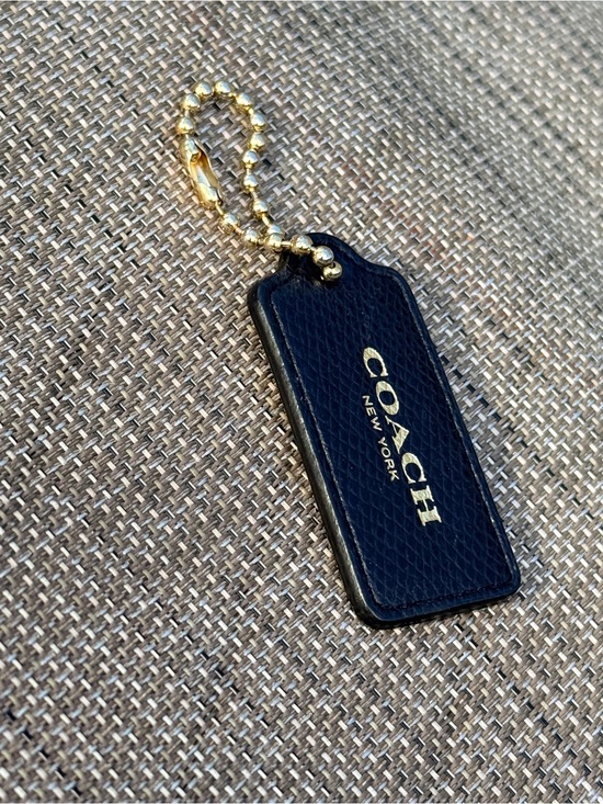 Coach Handbags - Coach Black and tan Leather with Gold Hang Tag